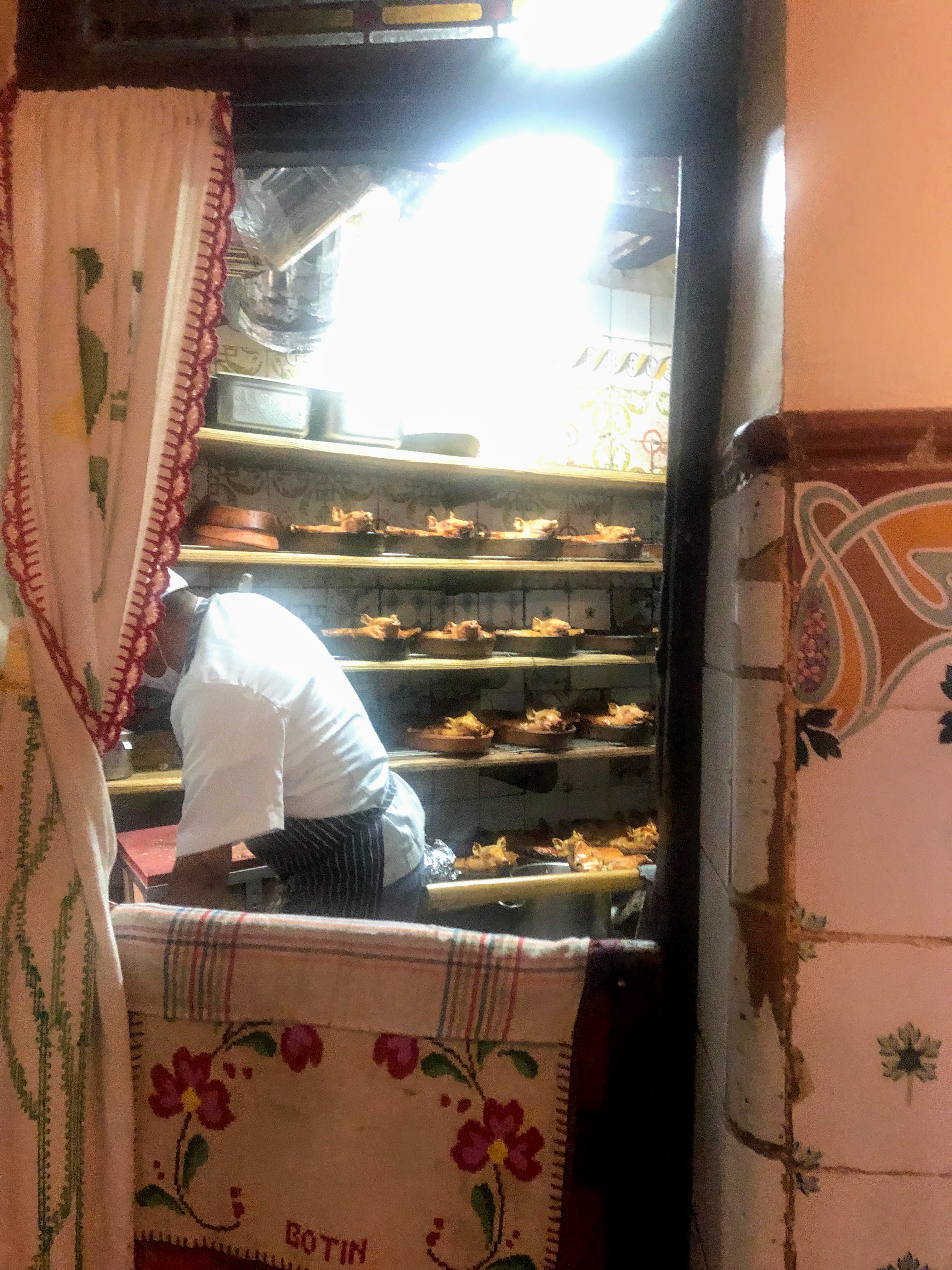 kitchen shelves with suckling pigs