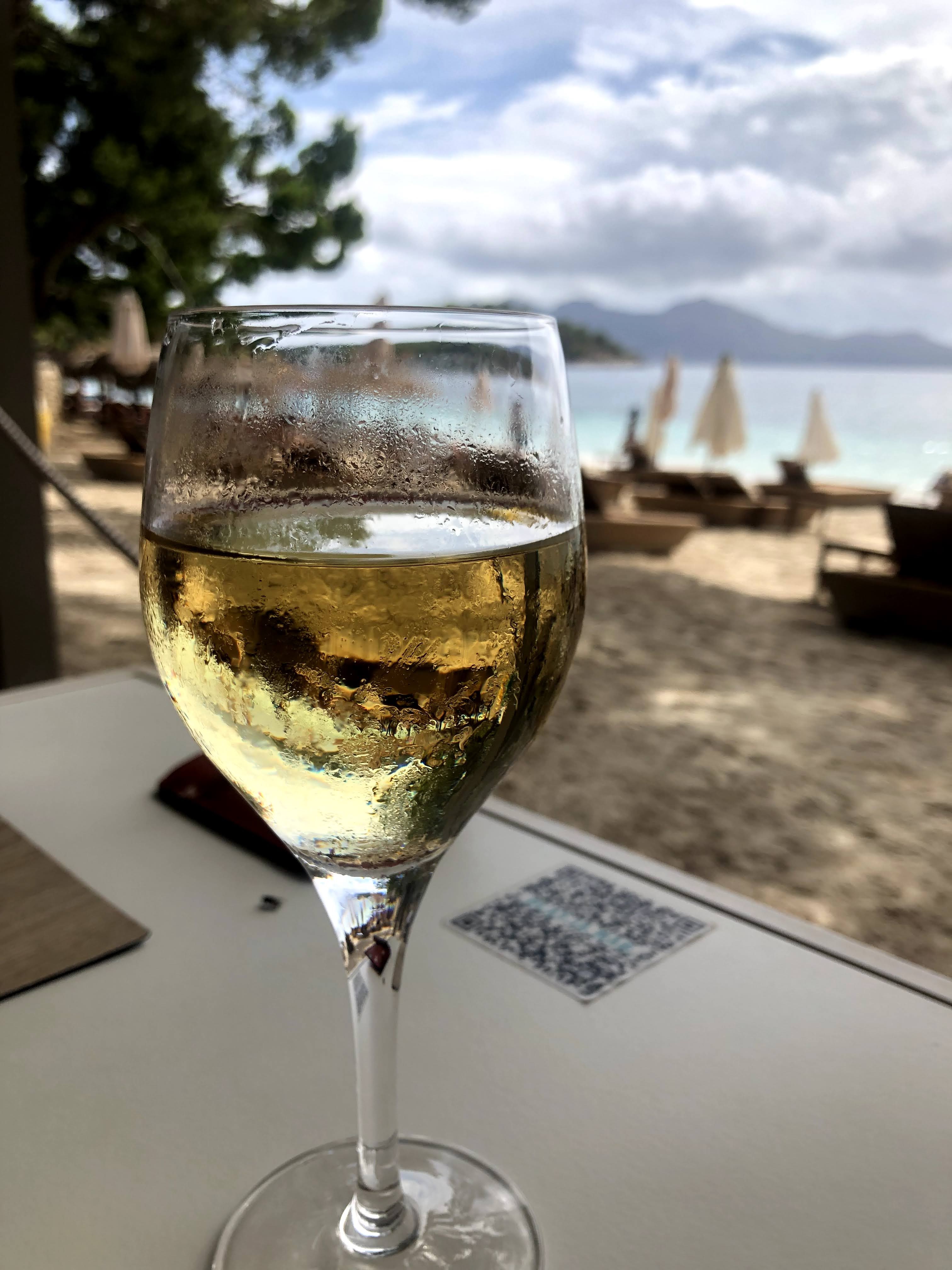 white wine glass on table top